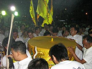 Presiding Trustee carrying the URN in Nine Emperor Gods festivals