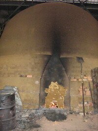 Baking the bakau log in Charcoal Factory in Taiping