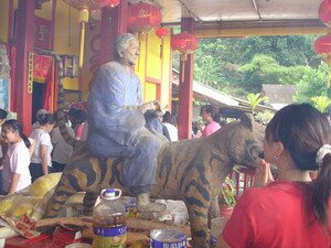 Monk  on tiger in One Thousand Two Hundred Steps Temple Penang