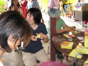 Folding josspaper in one thousand two hundred steps temple Penang Folding josspaper in one thousand two hundred steps temple Penang