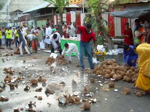 Coconuts breaking to clean the roads for Lord Muruga Thaipusam Penang Coconuts breaking to clean the roads for Lord Muruga Thaipusam Penang