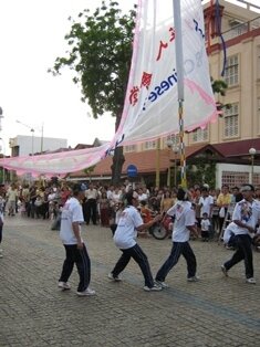 3 men chingay during chap goh meh in penang