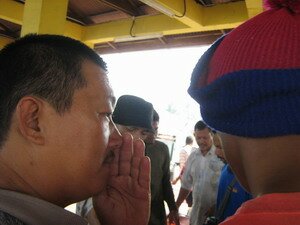 Man whispering during auction in Kuala Muda Kedah Man whispering during auction in Kuala Muda Kedah
