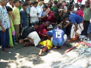 Being held down for skewring thaipusam penang Being held down for skewring thaipusam penang