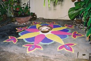 Colorful Kolam made of raw rice Colorful Kolam made of raw rice