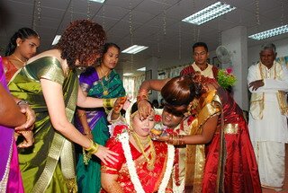 Uvaraani is a married woman with a red dot in traditional Wedding