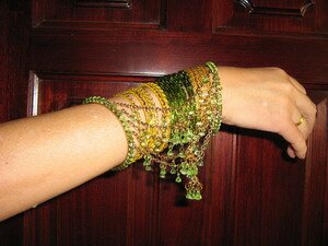 A set of decorative bangles with trimmings A set of decorative bangles with trimmings