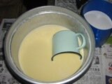 Mixing egg and coconut cream batter Mixing egg and coconut cream batter