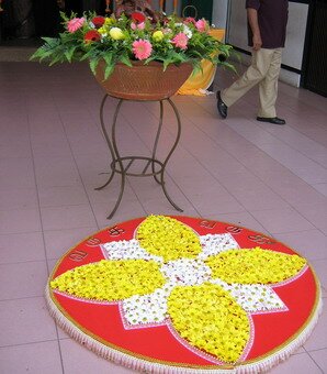 Plastic flowers and lace kolam Plastic flowers and lace kolam