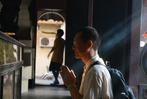 Praying in Penang Goddess of Mercy Temple