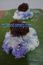 Sticky blue rice top with gula melaka and coconut shreds Pulut Inti, Sticky blue rice top with gula melaka and coconut shreds
