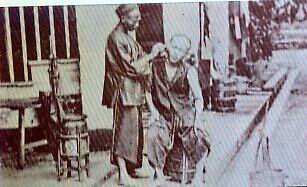 Chinese Barber in 1876 Malaya