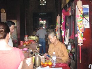 Nun on Duty in Snake Temple Nun on Duty in Snake Temple