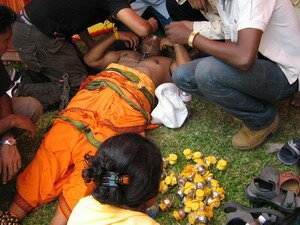 taking off hooks laying down after thaipusam penang taking off hooks laying down after thaipusam penang