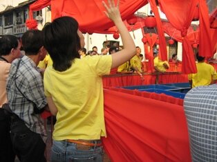 Throwing oranges during Chap Goh Meh in Penang