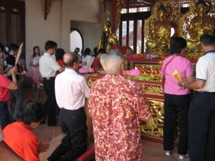 Praying to Buddha in Jade Emperor Temple Penang Praying to Buddha in Jade Emperor Temple Penang
