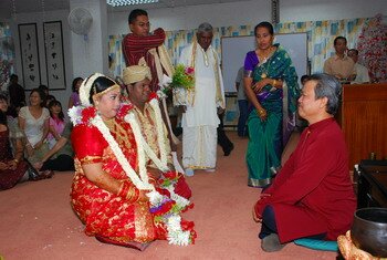 Listening to Marriage vows and blessing by Saka Gokai Dojo Chief