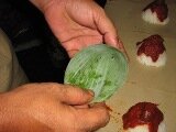 forming a conical shape with a banana leaf
