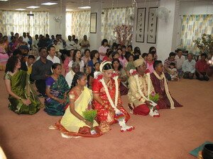 Uva and Jivan in Soka Gakkai in front of the holy altar
