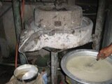 grinding and sieving the wet rice
